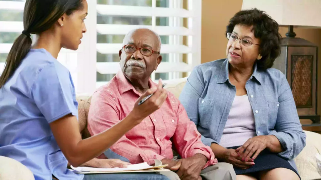 Nurse Making Notes during Home Visit with Senior Couple What is Hospice?